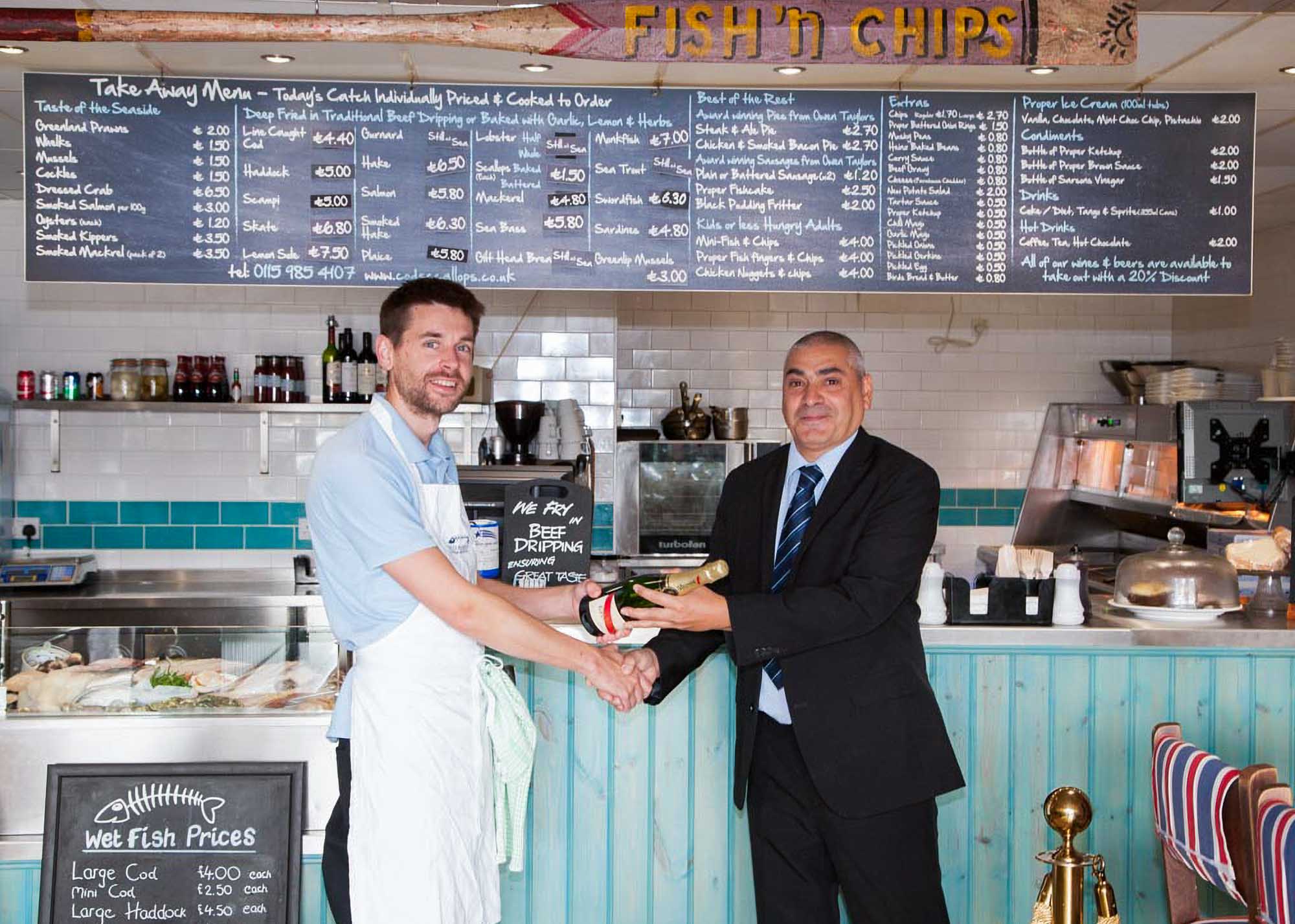 Award presentation photographed inside a fish and chip shop for a press release
