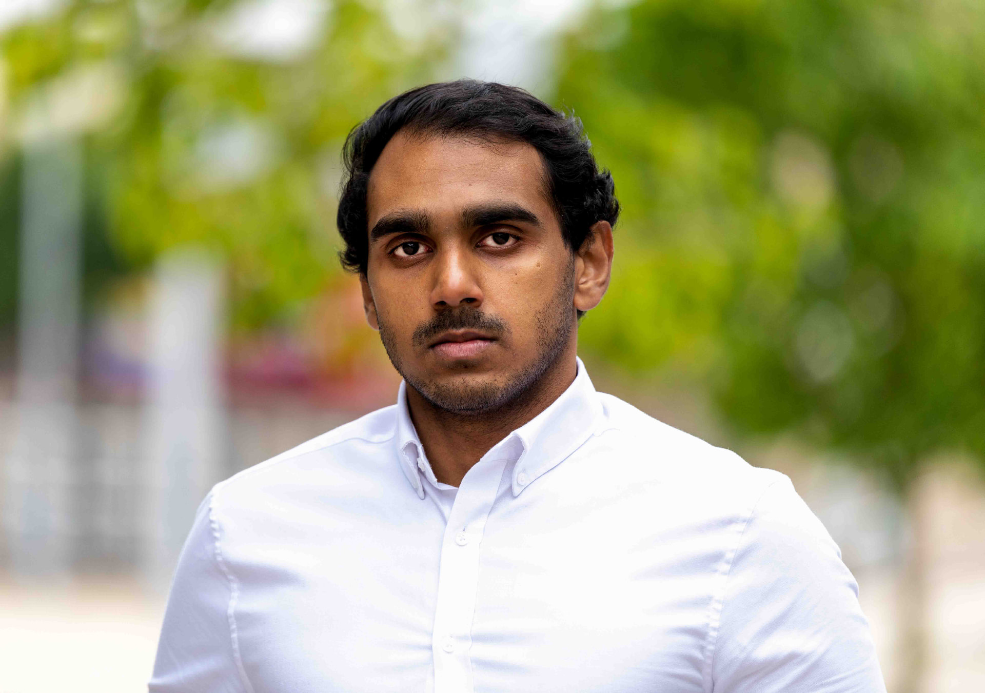 Outdoor executive portrait of a professional in a white shirt